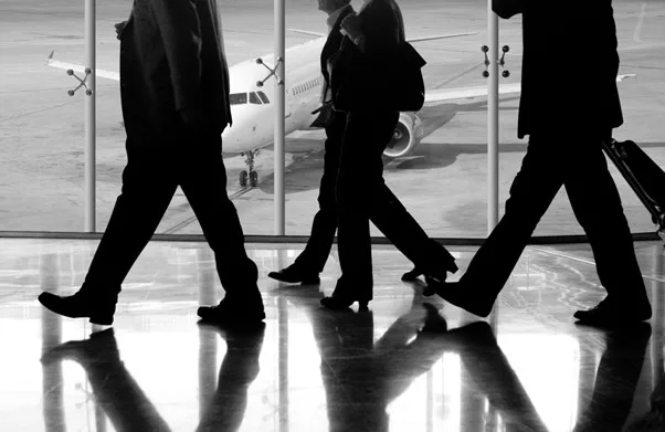 Black and white shot of travelers in airport