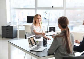 Human resources commission interviewing woman in office