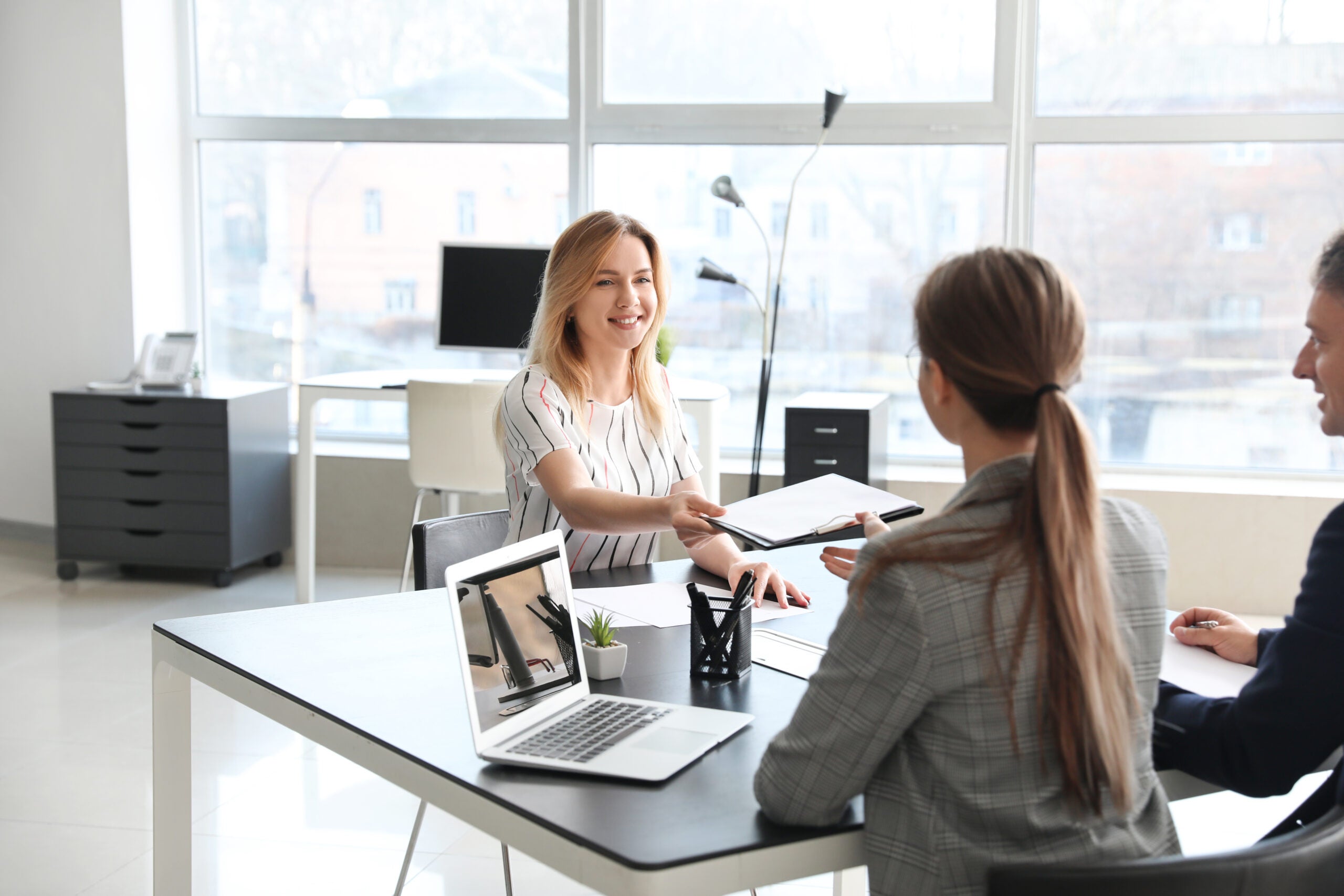 Human resources commission interviewing woman in office