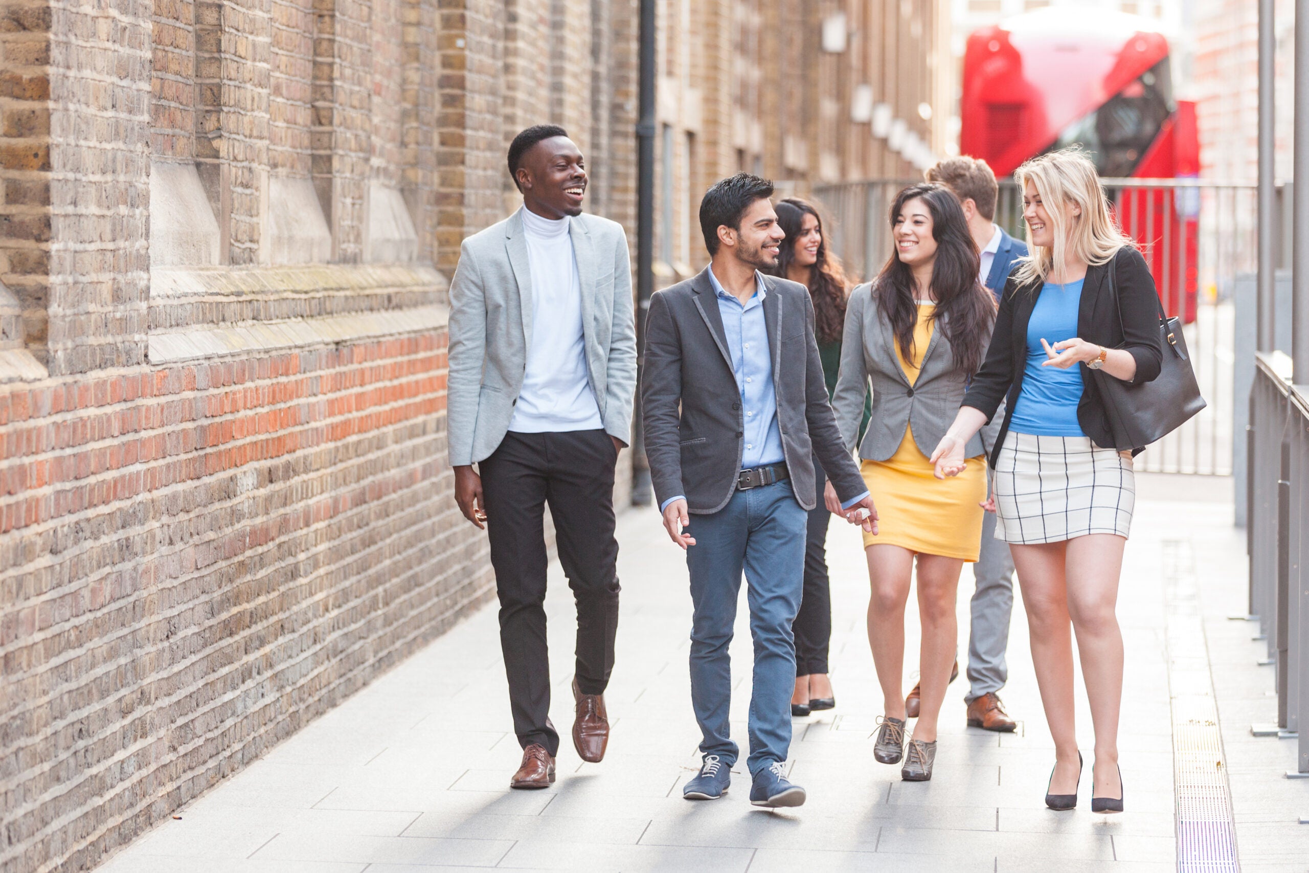 Group of young professional walking in the city