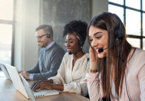 Customer service reps working at office.