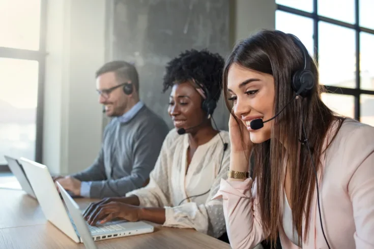 Customer service reps working at office.