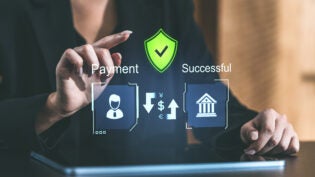 Digital payment interface with a person interacting with a screen displaying secure payment details, shield icon, and success on a blurred background