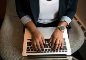 Hands typing on keyboard