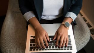 Hands typing on keyboard