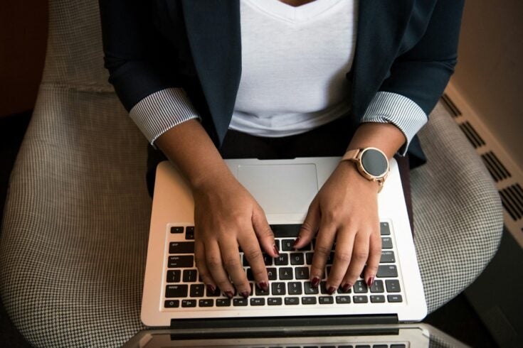 Hands typing on keyboard