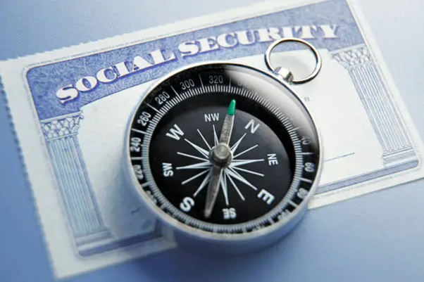 image of compass on top of social security card
