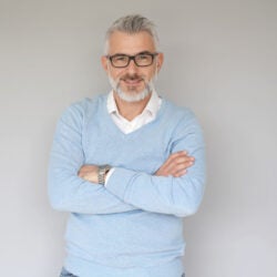 40 year old man, isolated on grey background