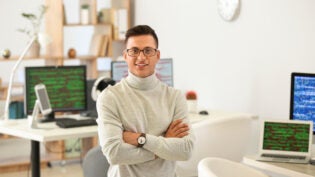 Portrait of male programmer in office