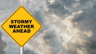 stormy weather sign against cloudy sky