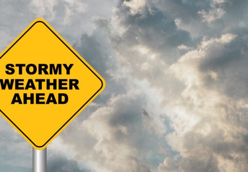 stormy weather sign against cloudy sky