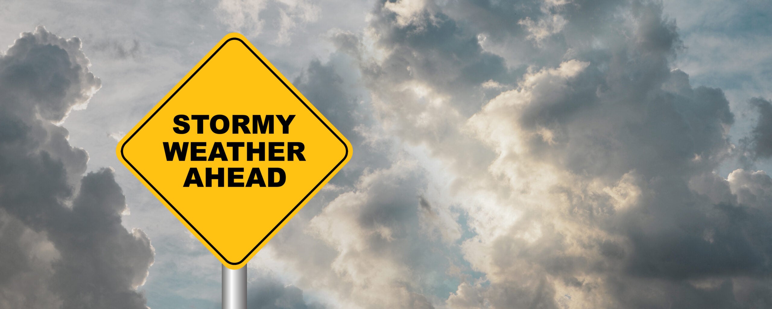 AdobeStock_437867632 stormy weather sign against cloudy sky