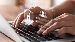 hands typing, image of cybersecurity