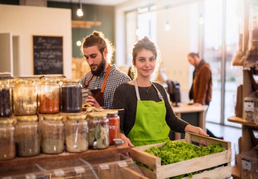 Couple working in a bulk food store