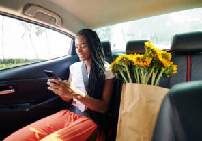 Woman riding in taxi