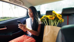 Woman riding in taxi