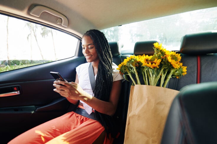 Woman riding in taxi