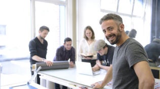 advertising agency owner and his team